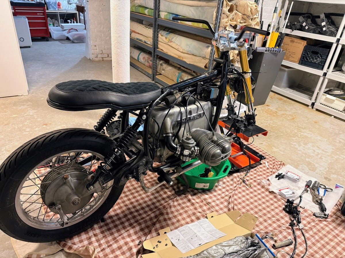 Current state — stripped down, gold forks, new subframe taking shape
