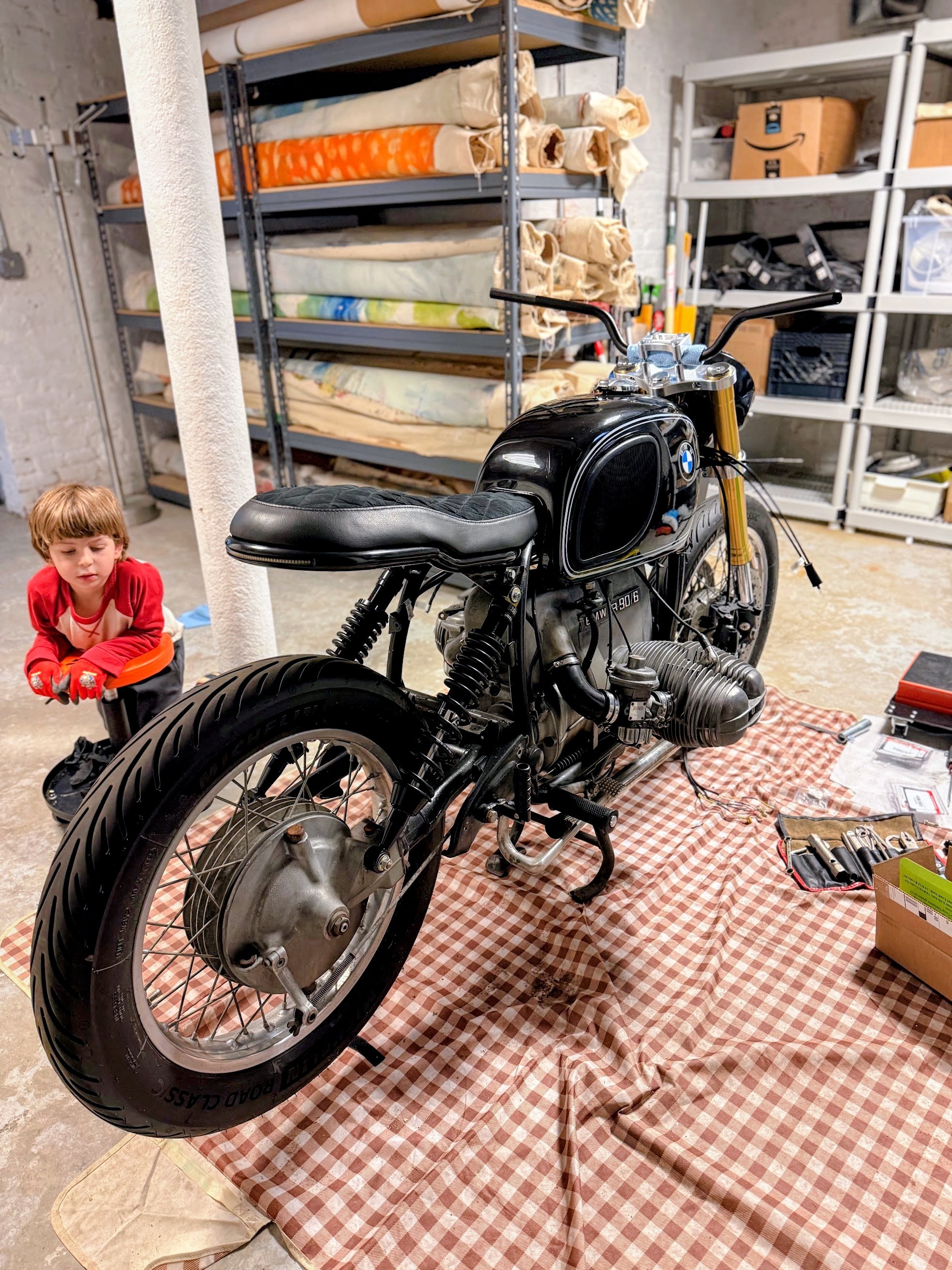 BMW R90/6 street racer with two wheels installed in the workshop