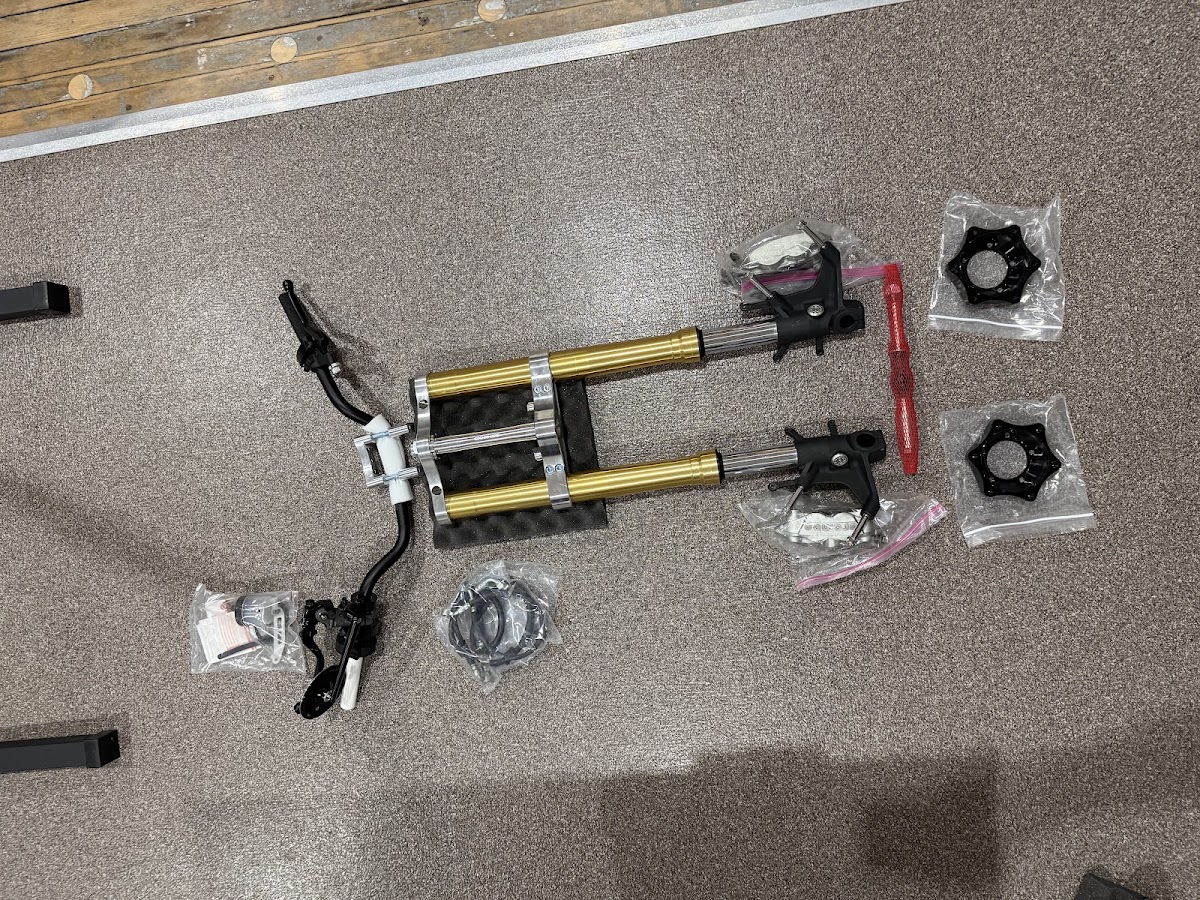 Parts arriving — clip-ons, fork components, hardware