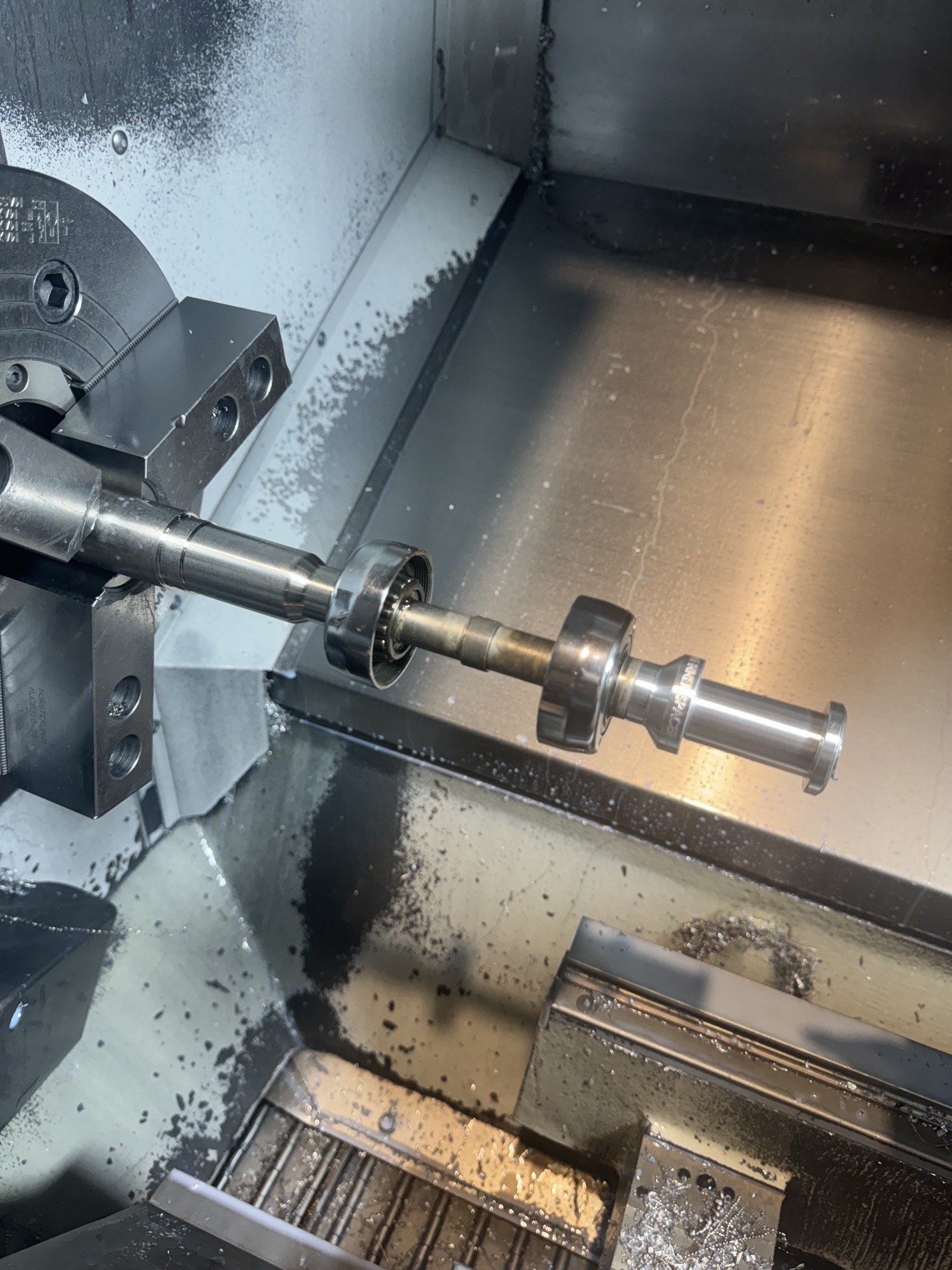 Custom front axle being machined in a CNC lathe